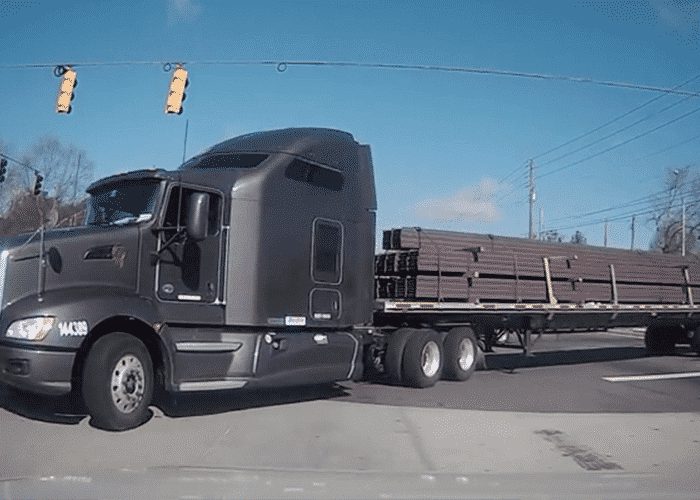 VIDEO: Turning Truck Hits Car In Intersection, Keeps Driving