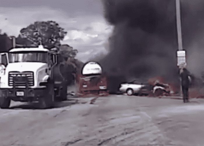 VIDEO: Police Rescue Woman After She Cut Off Truck, Causing Fiery Crash