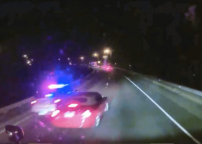 VIDEO: Car Trying To Squeeze Past Truck Almost Hits Trooper