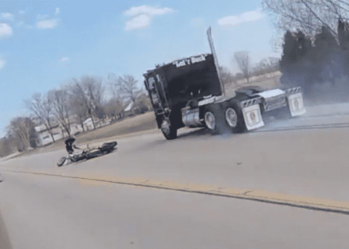 VIDEO: Motorcyclists Crash Trying To Avoid Dog, Then Almost Get Crushed By Truck