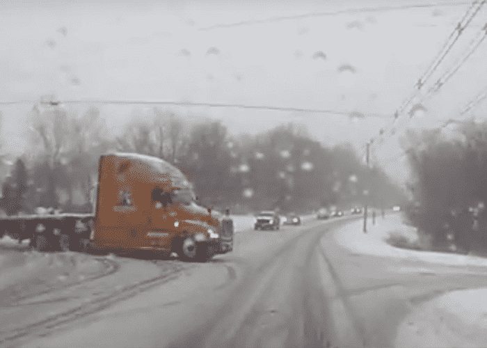 VIDEO: Cammer Ends Up In Ditch As Truck Tries To Clear Icy Intersection