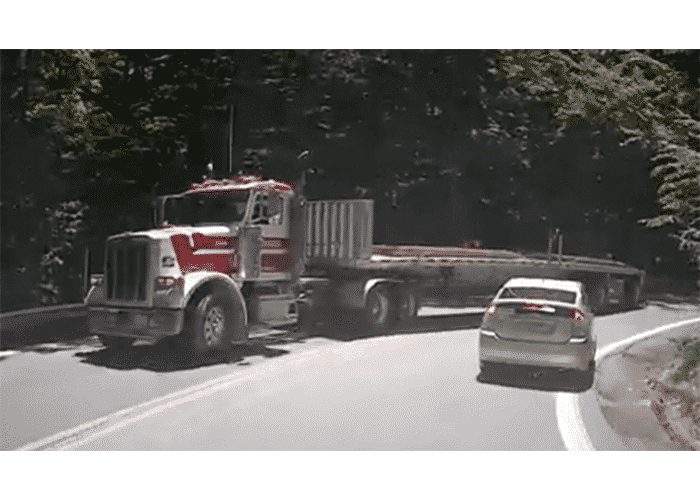 VIDEO: Flatbed Sideswipes Cammer On A Curve