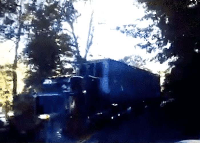 VIDEO: Pickup Gets Crunched By Truck In Tight Curve