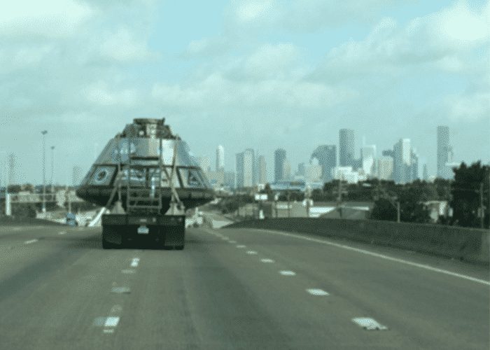 Spacecraft Orion Rides A Flatbed Into Downtown Houston