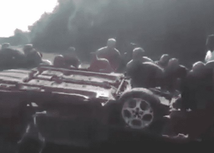 VIDEO: 15 Good Samaritans Work Together To Rescue Flipped Motorist