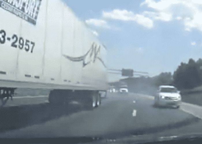 VIDEO: Semi PITs And Plows Car Into Concrete Barrier