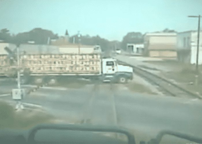 VIDEO: Semi Tries To Beat Train, Then This Happens…