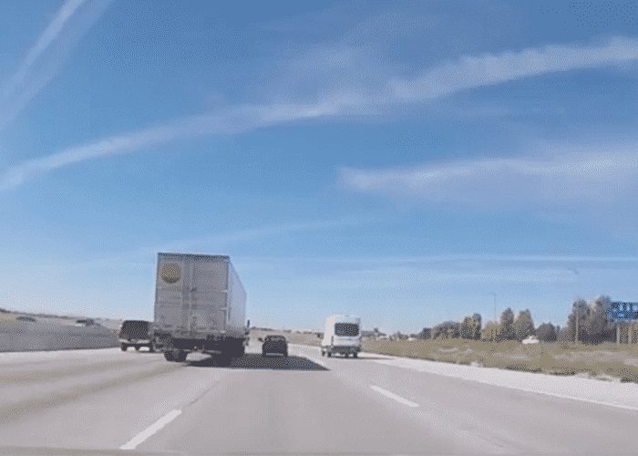 VIDEO: Motorist Comes Close To Learning A Hard Lesson About Driving Alongside A Truck