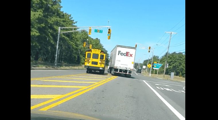 VIDEO: School Bus Squabbles With FedEx Truck