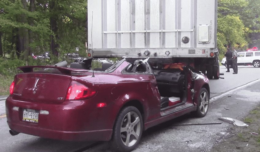 Car Crashes Under Disengaged Flatbed Trailer