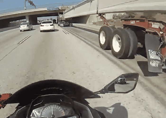 VIDEO: Another Idiot Motorcyclist Tries The “Under The Truck” Stunt