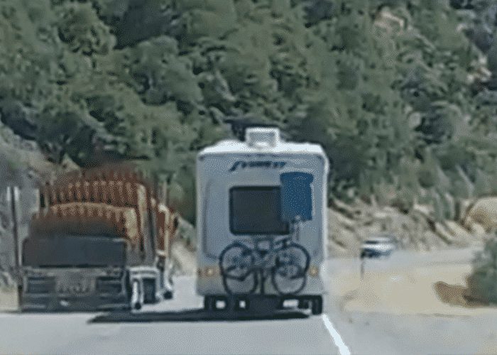 VIDEO: Four Wheeler Nearly Pancaked When Semi Passes RV