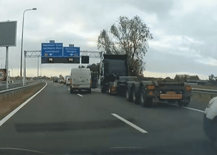 VIDEO: Van Driver Battles Flatbed For Position
