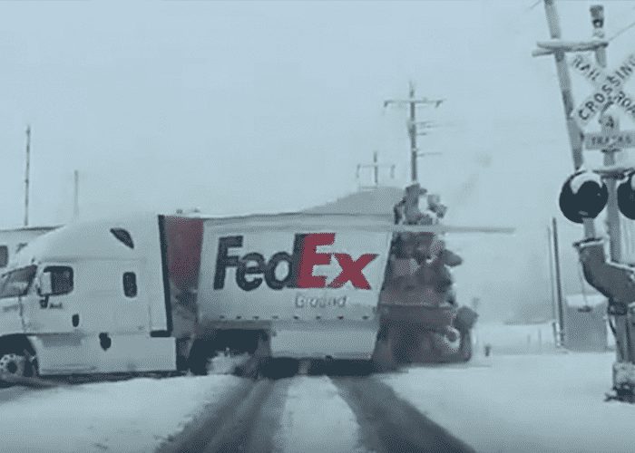 VIDEO: Crossing Gates Were Up When Train Hit FedEx Truck