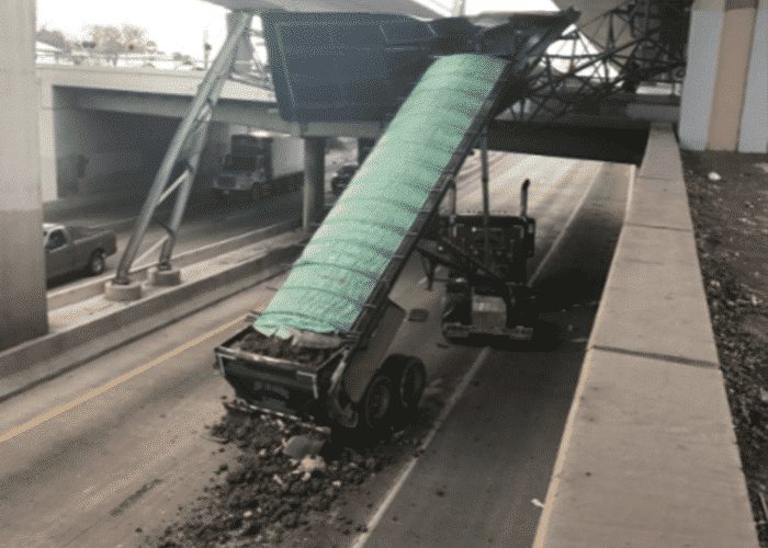 Raised Dump Trailer Destroys TxDOT Sign On I-10