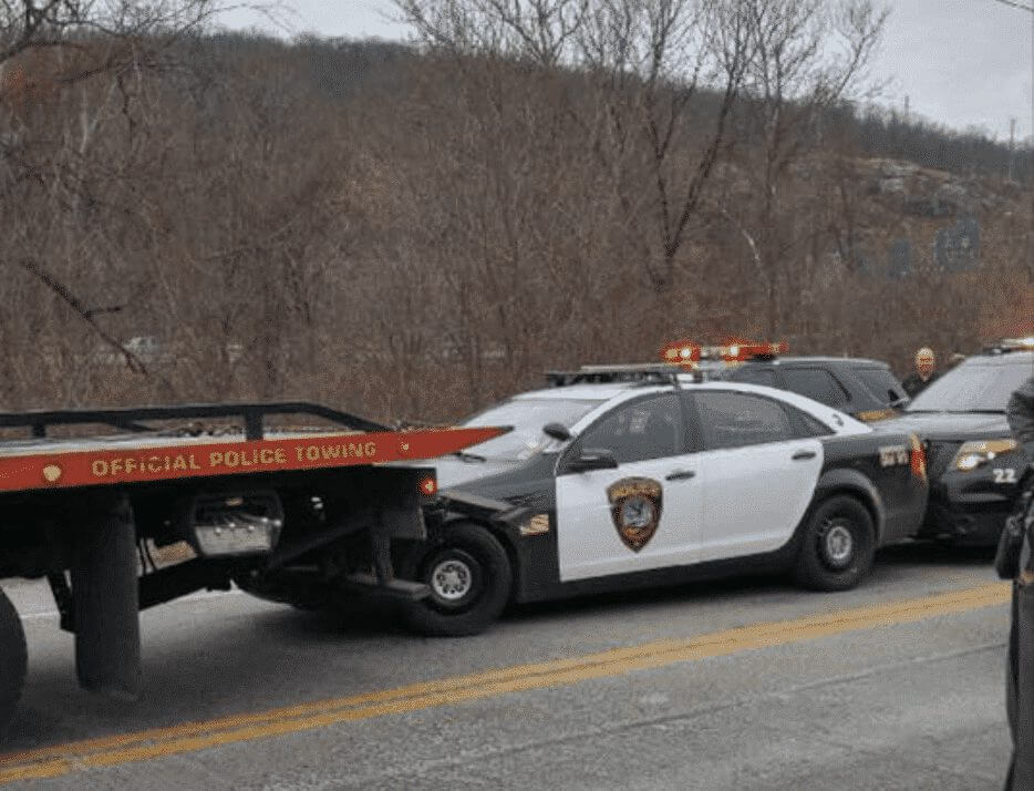Stolen Tow Truck Drags Police Cruiser During Two State Chase