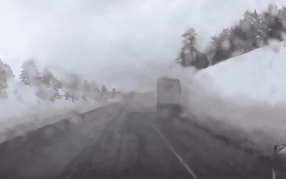 VIDEO: Pothole Sends Semi Into Snowbank