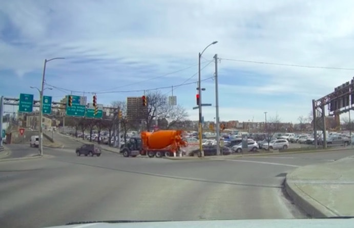 VIDEO: Cement Truck Topples And Taps Jeep