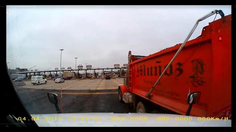 VIDEO: Dump Truck Sideswipes Semi At Tollbooth
