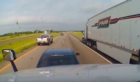 VIDEO: Car’s Sudden Highway Stop Leads To Rear End Semi Crash