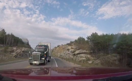 VIDEO: Motorist Comes Inches From Head On Collision With Semi