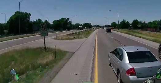 VIDEO: Car Attempts Illegal U-Turn In Front Of Fully Loaded Truck