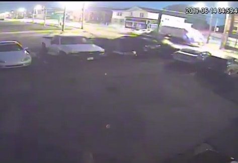 VIDEO: Red Light Runner Sends Trash Truck Crashing Into Barber Shop