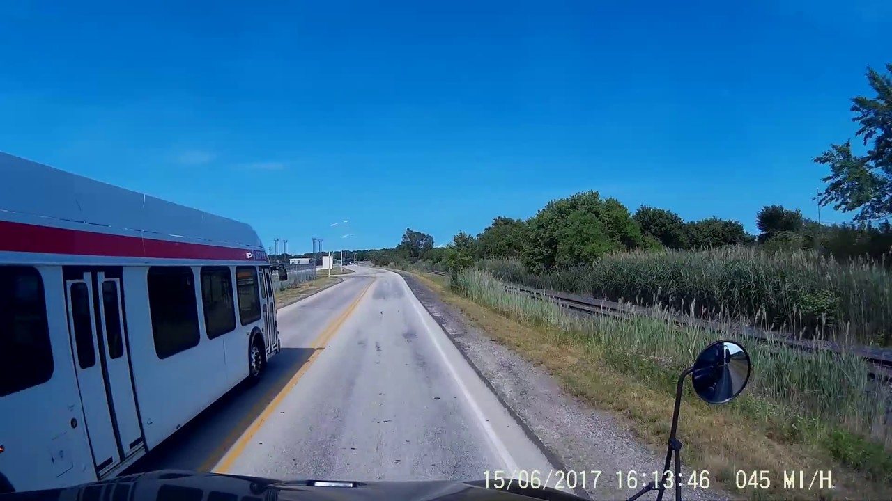 VIDEO: Bus Driver In A Hurry To Pass One Semi Almost Collides Head On With Another Truck