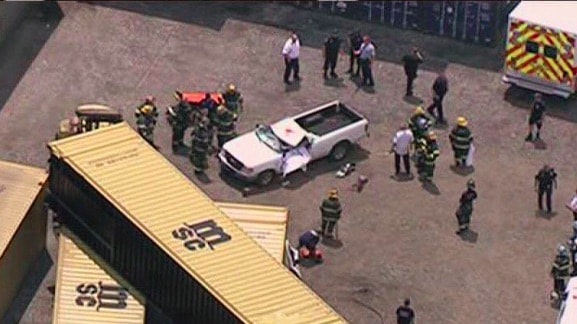 Worker Killed When Shipping Container Falls On Pickup