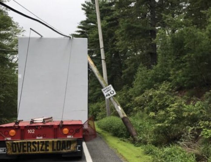 Truck Hauling Modular Home Takes Down Power Poles