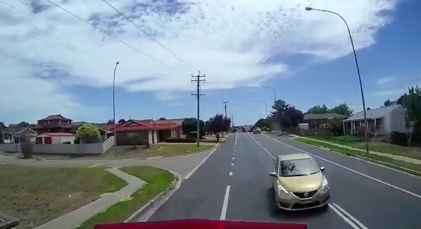 VIDEO: Car drives head-on into path of truck