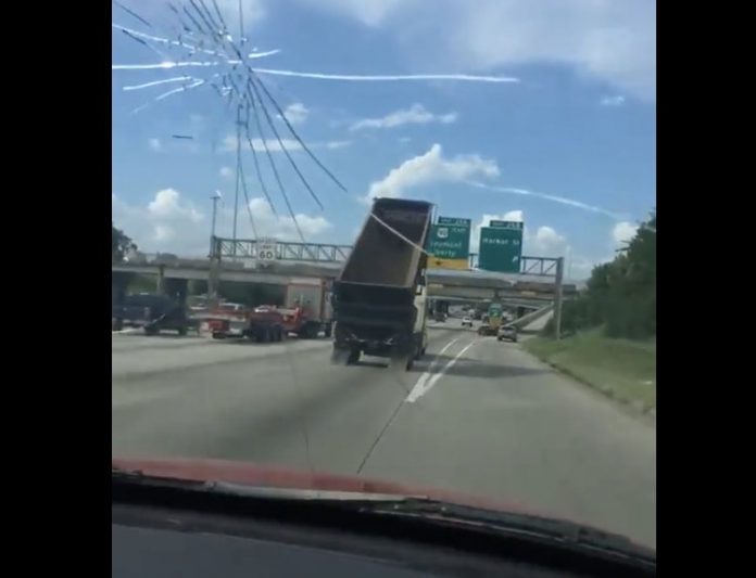 VIDEO: Dump Truck Takes Out Houston Highway Sign