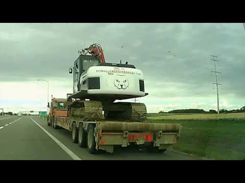 VIDEO: Tall Truck Load Collides With Bridge