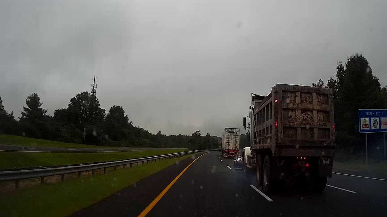 VIDEO: Dump Truck Takes Sedan For A Ride