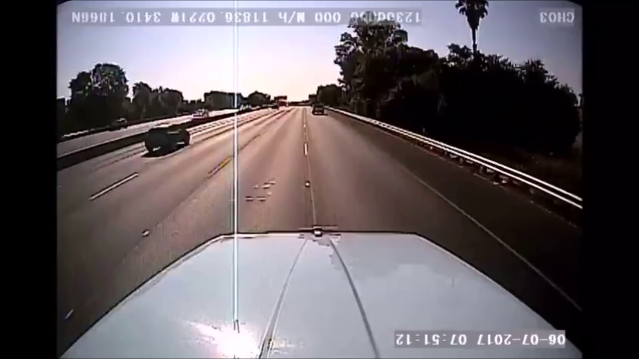 VIDEO: Car Tries To Merge Into Apparently Invisible Semi Truck