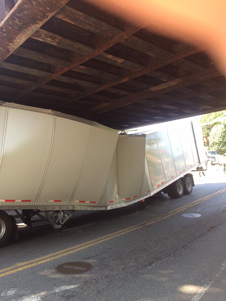 truck slides off overpass