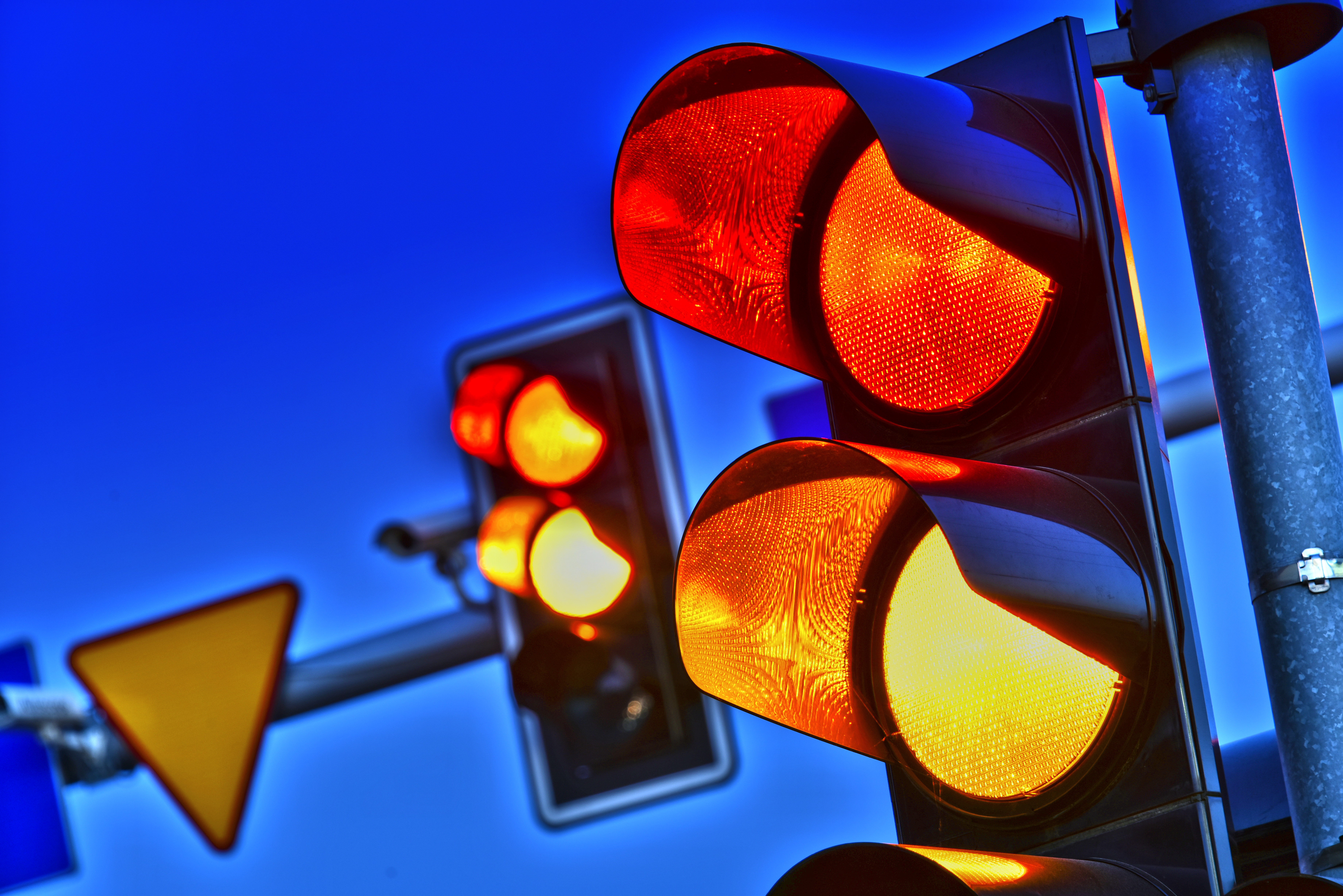 Truck hits police cruiser turning left in intersection