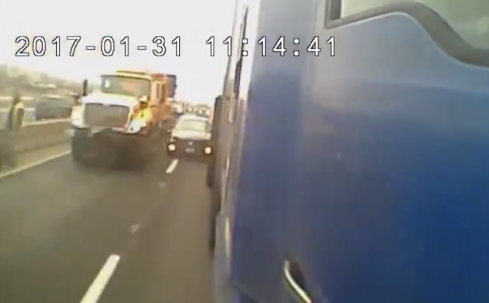 VIDEO: Semi's side dash cam captures Caddy's crash into construction crew