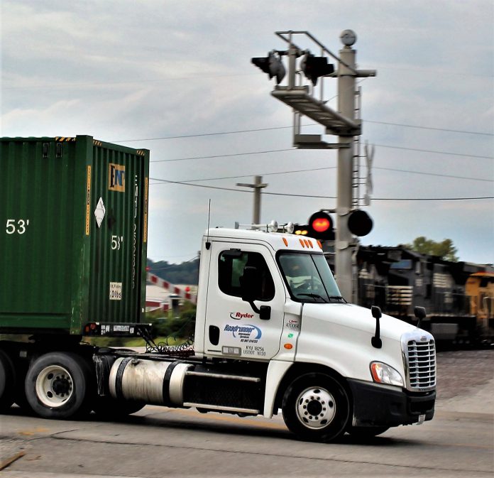 Photo by photo, watch as a truck comes inches from being pancaked by a train
