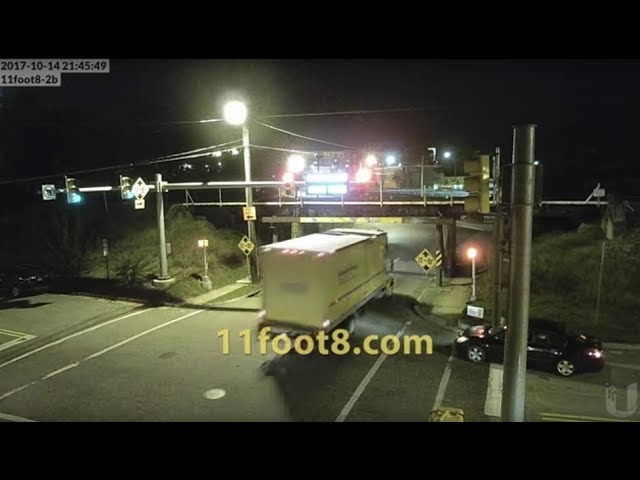 VIDEO: Can opener bridge takes the top off of red-light-running box truck