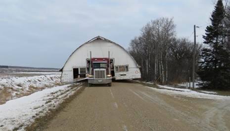 Trucker cited for hauling 36 foot wide shed without permit