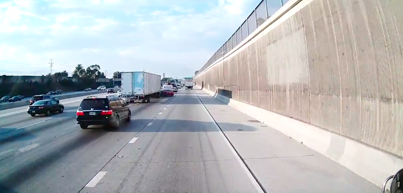 VIDEO: Truck helps car make lane change