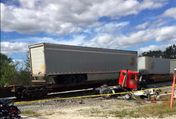 FHP: Truck driver killed after he tried to beat a train
