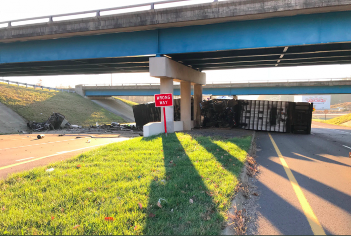 One dead, another hurt, after FedEx truck flips off overpass