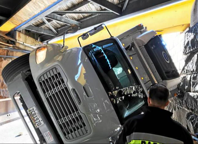 Box truck driver gets so stuck that he's sideways under Pennsylvania railroad overpass