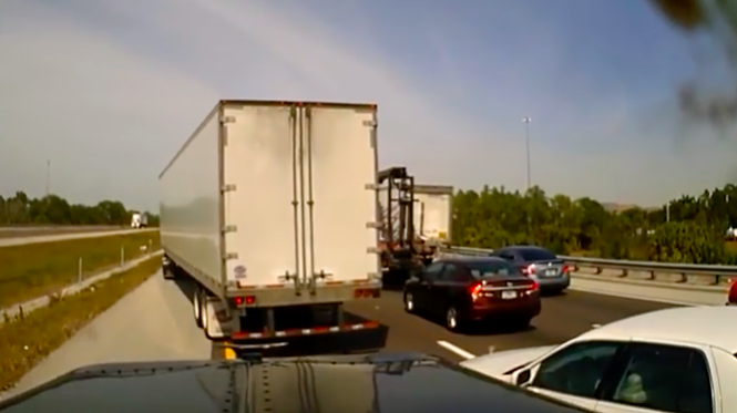VIDEO: Sneaky sedan driver pays the price for cutting in front of a truck