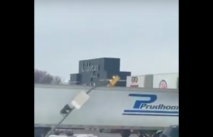 VIDEO: Truck driver takes traffic light for a ride