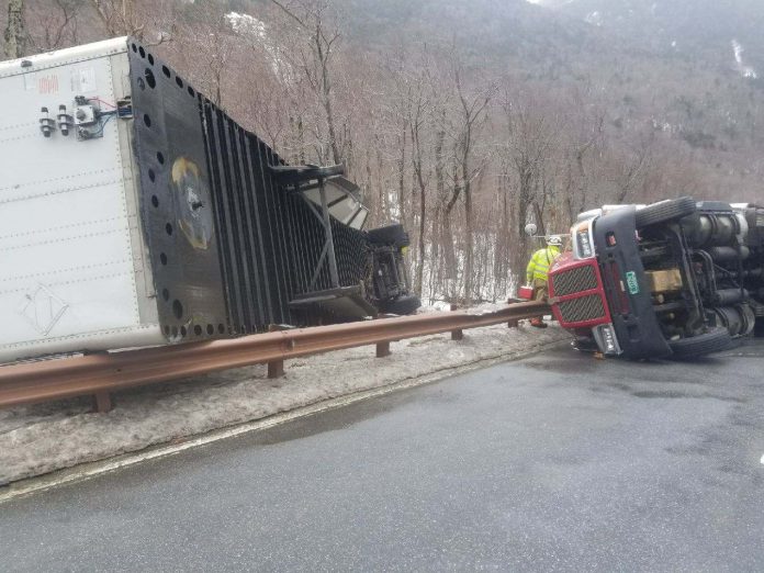 Wind blows over three trucks, one lands on occupied New Hampshire trooper's cruiser