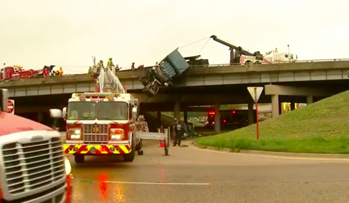 Trucker killed in fiery crash that left rig dangling from Dallas interstate