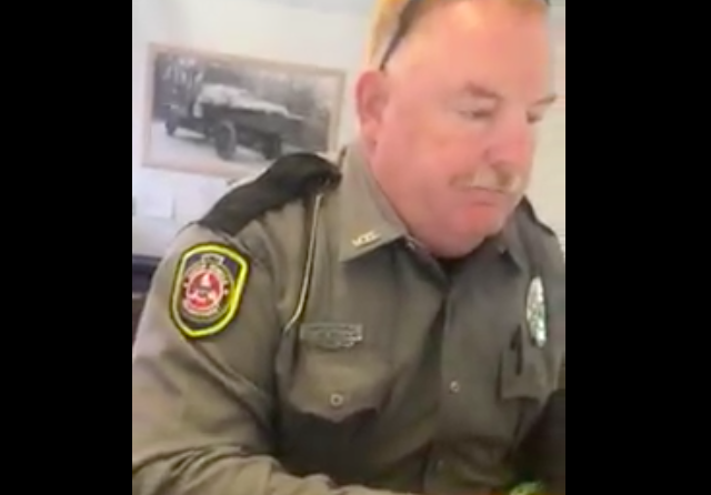 Trucker argues that he's only overweight because of snow and ice accumulation. DOT officer writes tickets anyway.
